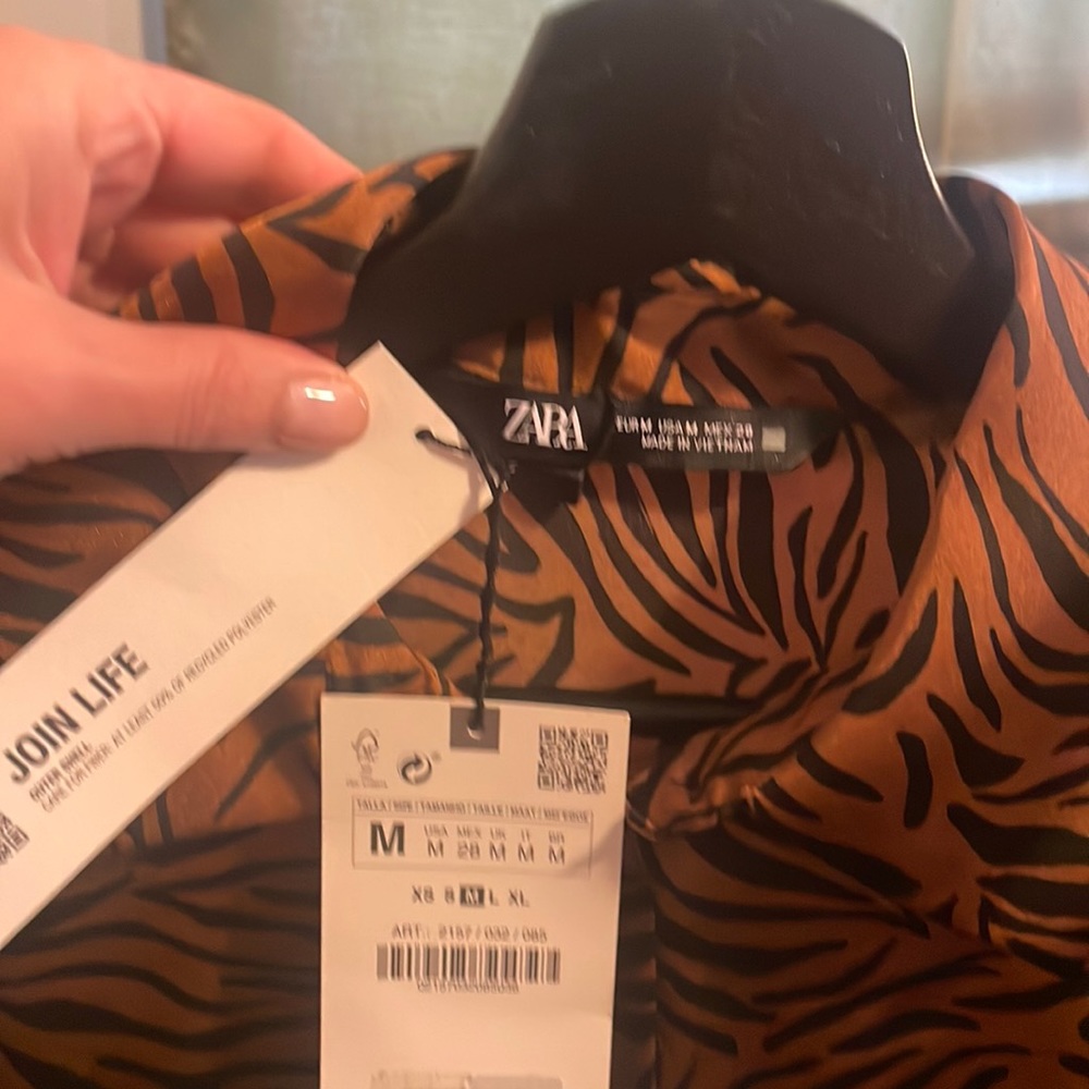Animal print blouse never worn. Gained weight.